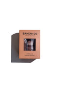 Bahen & Co vanilla and almond nougat chocolate bar with visible almonds and smooth chocolate coating on a white background.