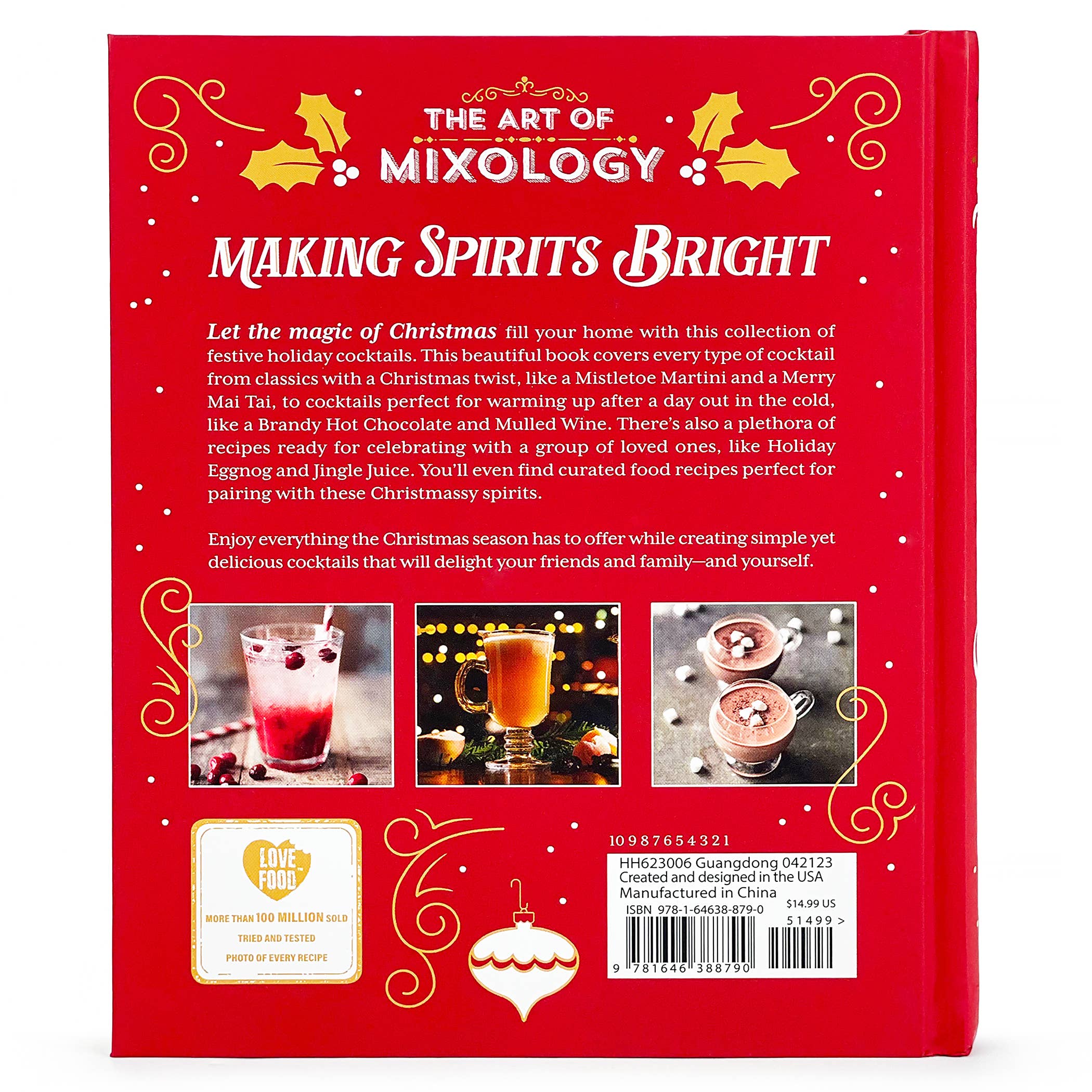 Open book titled "Art of Mixology: Making Spirits Bright" Christmas cocktails guide by Cottage Door Press on a wooden table.