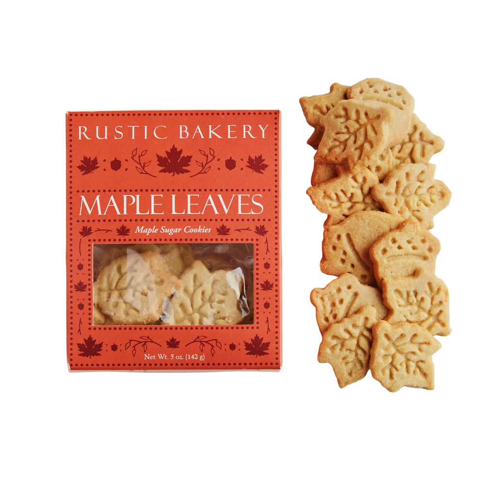 Rustic Bakery Maple Leaves sugar cookies shown next to their red packaging box on a white background.