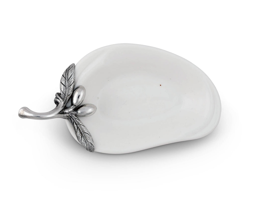 Vagabond House olive oil server for charcuterie, featuring a decorative dish with intricate metalwork and a small olive oil bottle.