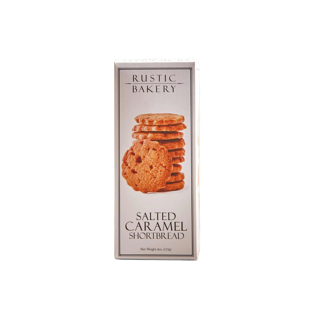 Rustic Bakery salted caramel shortbread cookies with a golden-brown crust and caramel filling, on a rustic plate.