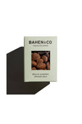 Bahen & Co organic milk chocolate with brulee almonds, showcasing a close-up of the chocolate bar with almond pieces.