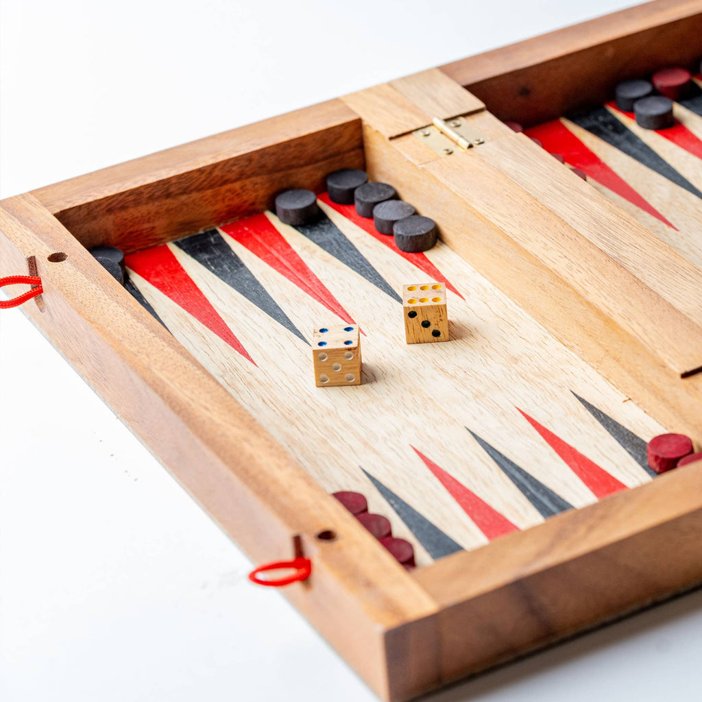 Backgammon game set with mango wood pieces, checkered playing surface, and game accessories from Verve Culture.