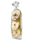 Dardimans California Crisps crispy apple slices snack in a clear bowl, showing thin, dried apple pieces with a golden color.