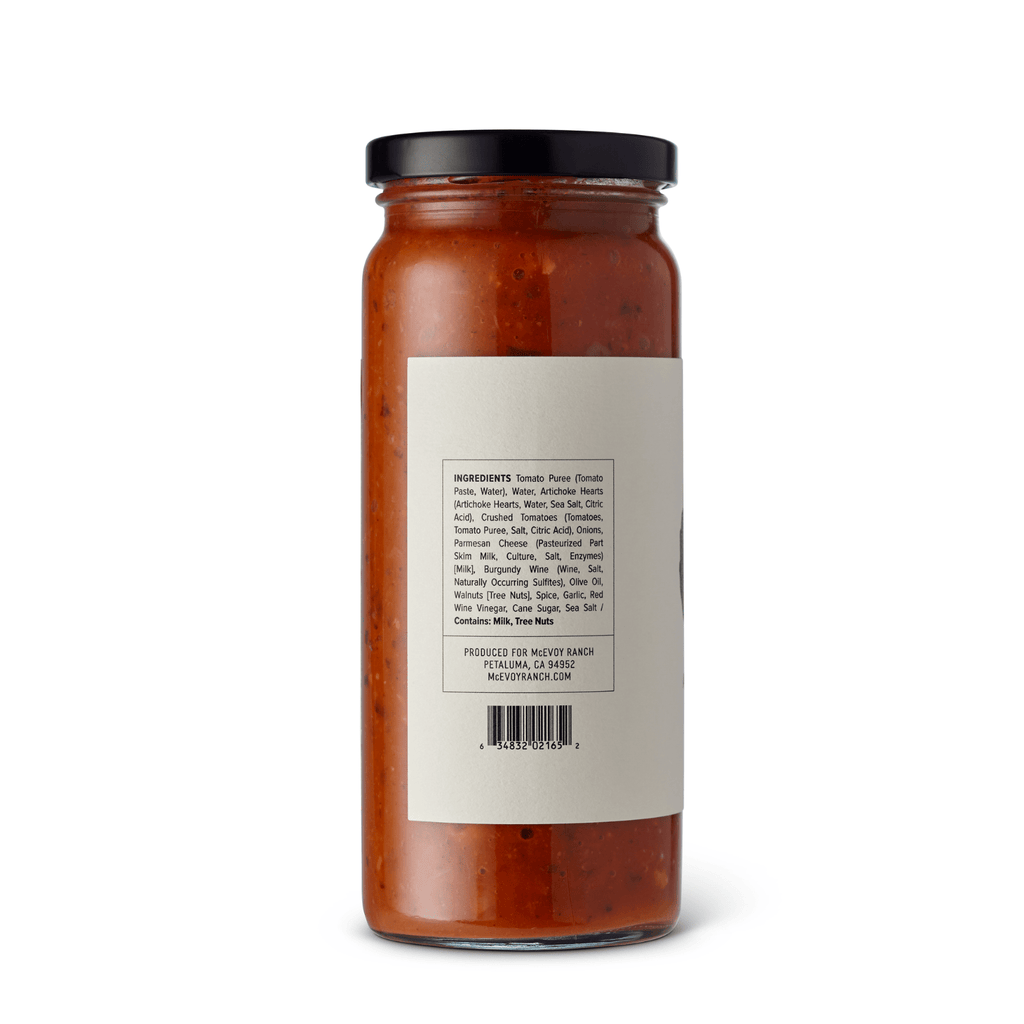 Jar of McEvoy Ranch Basil and Pine Nut Pomodoro Sauce, 16 oz, a flavorful pantry staple with fresh basil and pine nuts.