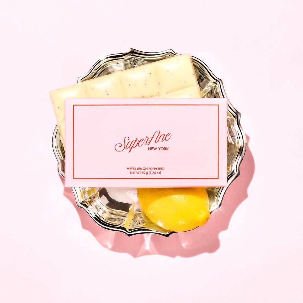 Superfine Chocolate Meyer Lemon Poppyseed Bar, a chocolate and candy treat with lemon and poppyseed flavor visible in the image.