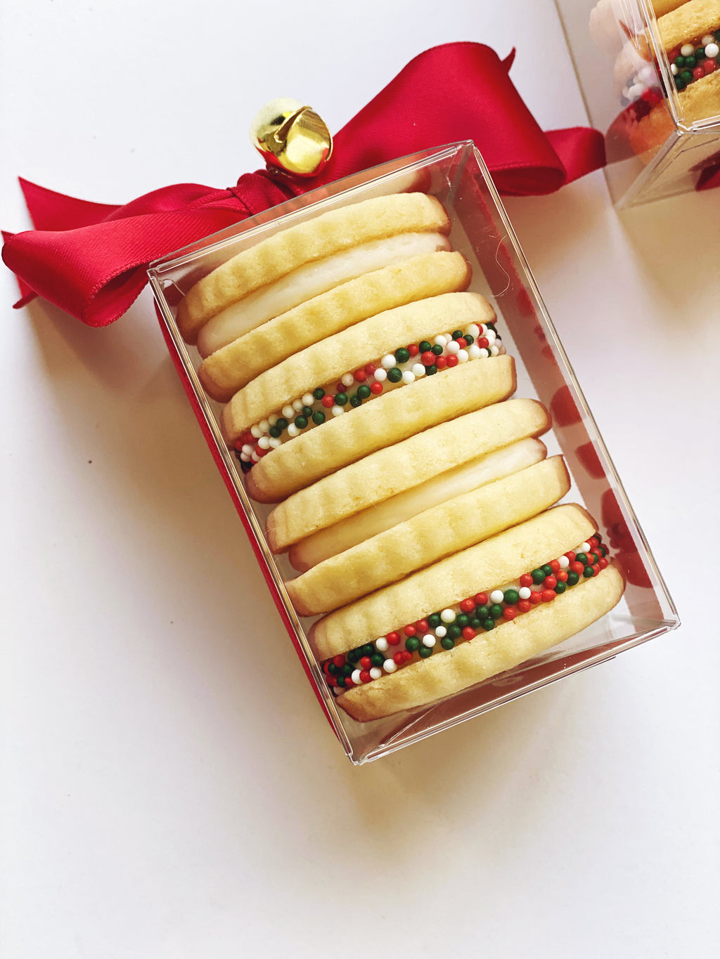 Four boxes of Poppins & Post buttercream sandwich cookies with creamy filling and crisp cookie layers.