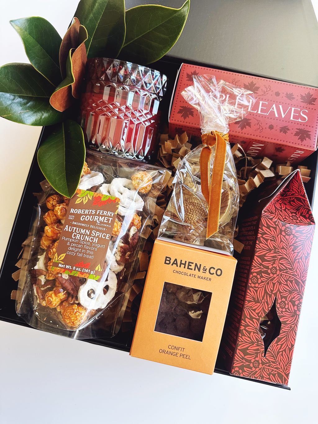 Fall Hostess gift box from Poppins & Post featuring autumn-themed packaging and assorted treats inside.