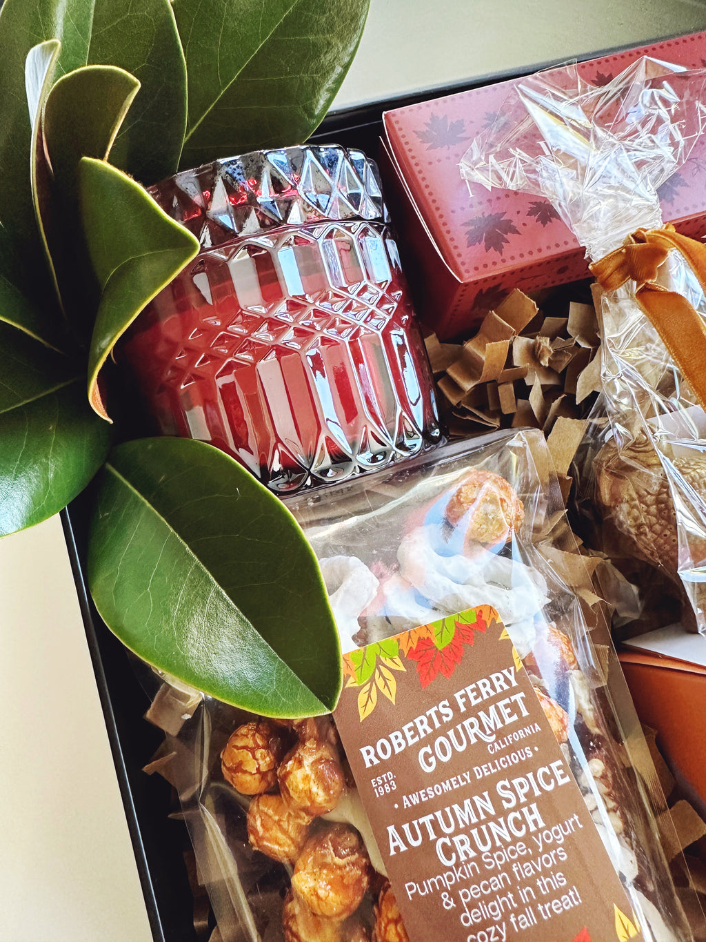 Fall Hostess gift box from Poppins & Post with seasonal wrapping and decorative autumn accents.