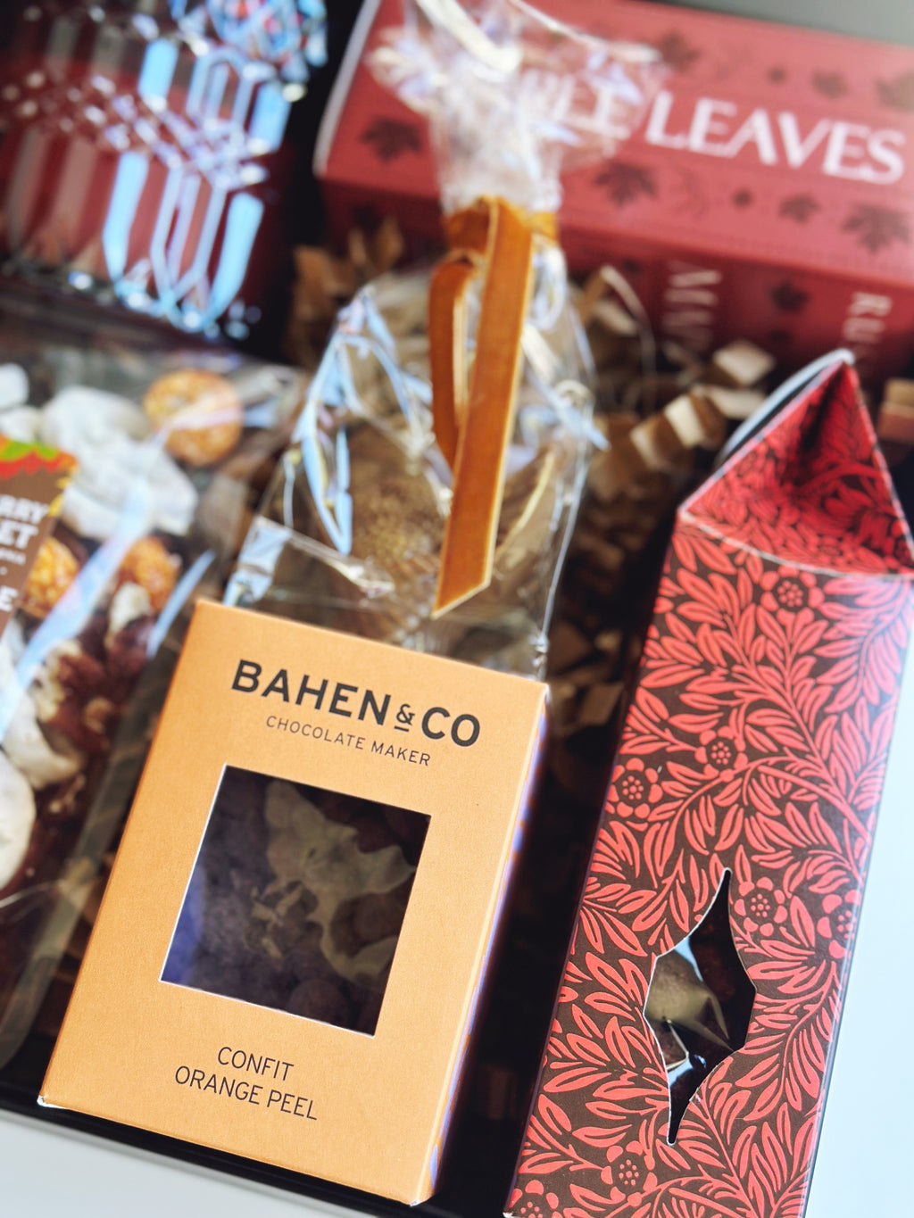 Fall Hostess gift box by Poppins & Post featuring seasonal packaging and assorted treats in a decorative tin.