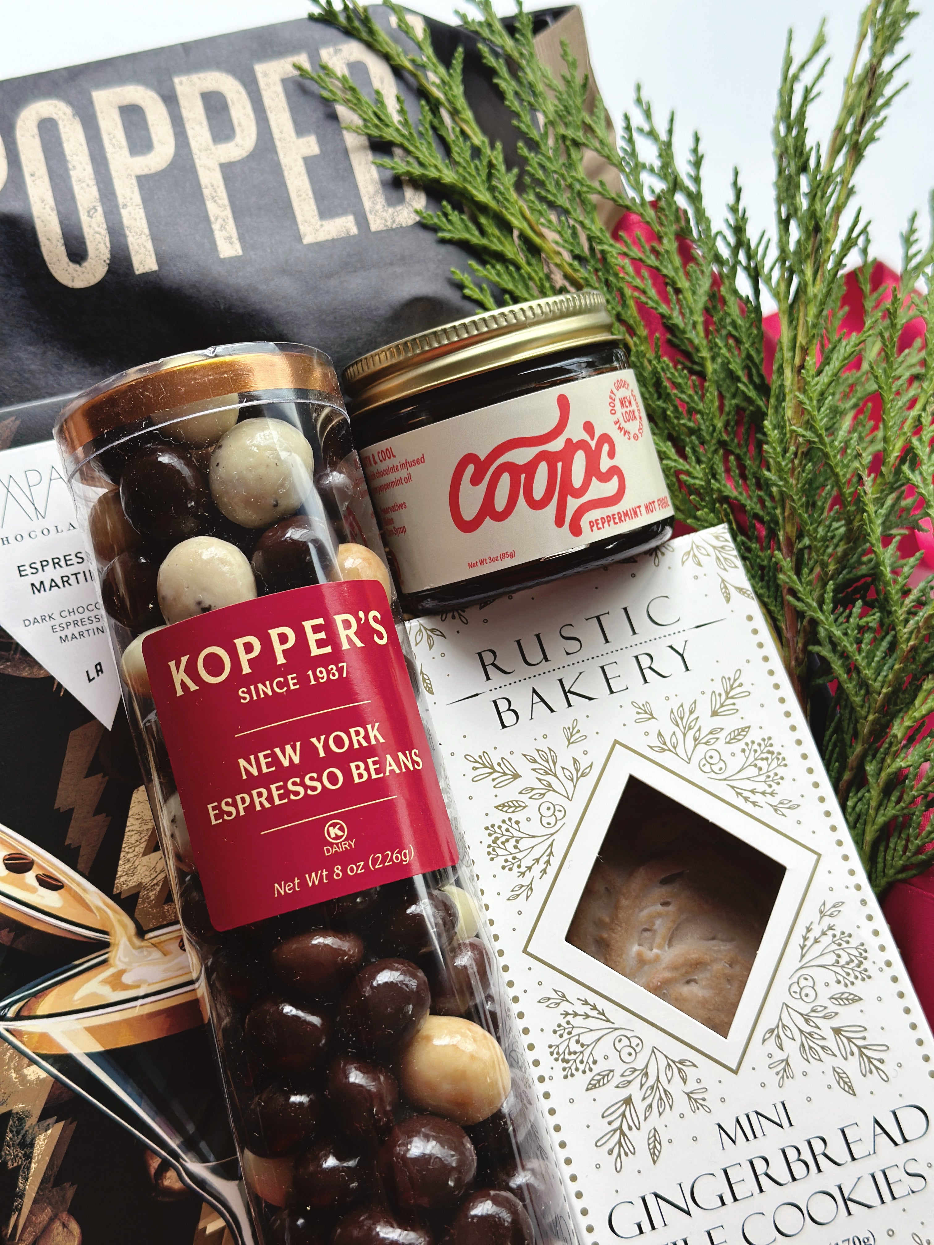 Gift box of espresso and dark chocolate from Poppins & Post, featuring assorted chocolates and coffee treats in elegant packaging.