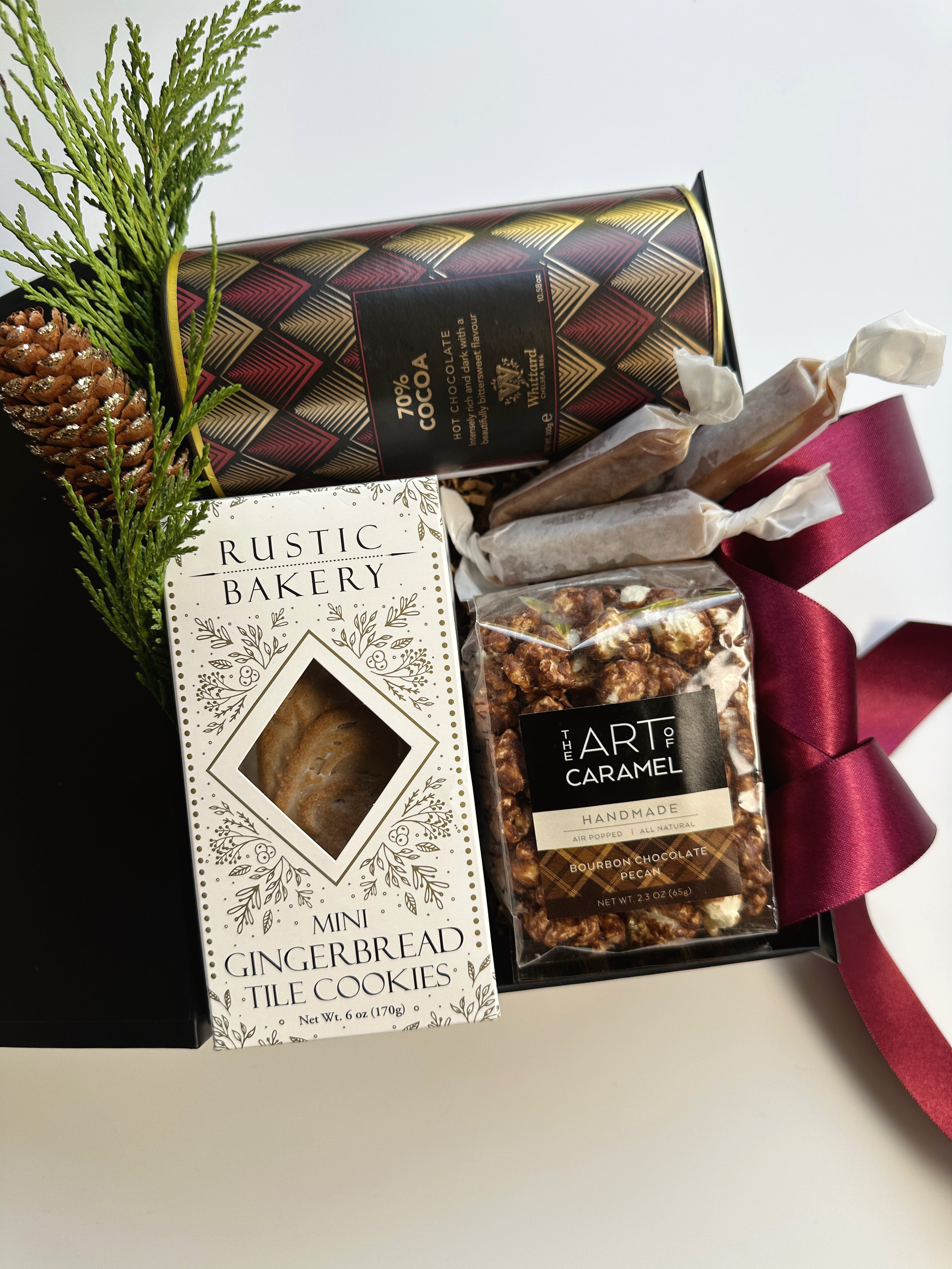 Gift box of Cocoa and Cookies from Poppins & Post featuring an assortment of chocolates and baked treats.