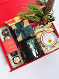 Poppins & Post holiday gift box with assorted sweets, wrapped in festive packaging with colorful candies and treats inside.
