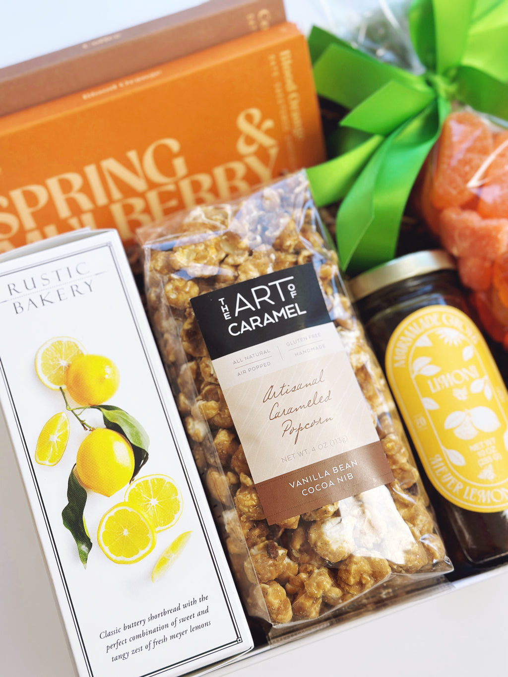 Spring Citrus gift box by Poppins & Post with colorful citrus-themed packaging and assorted fresh citrus fruits.