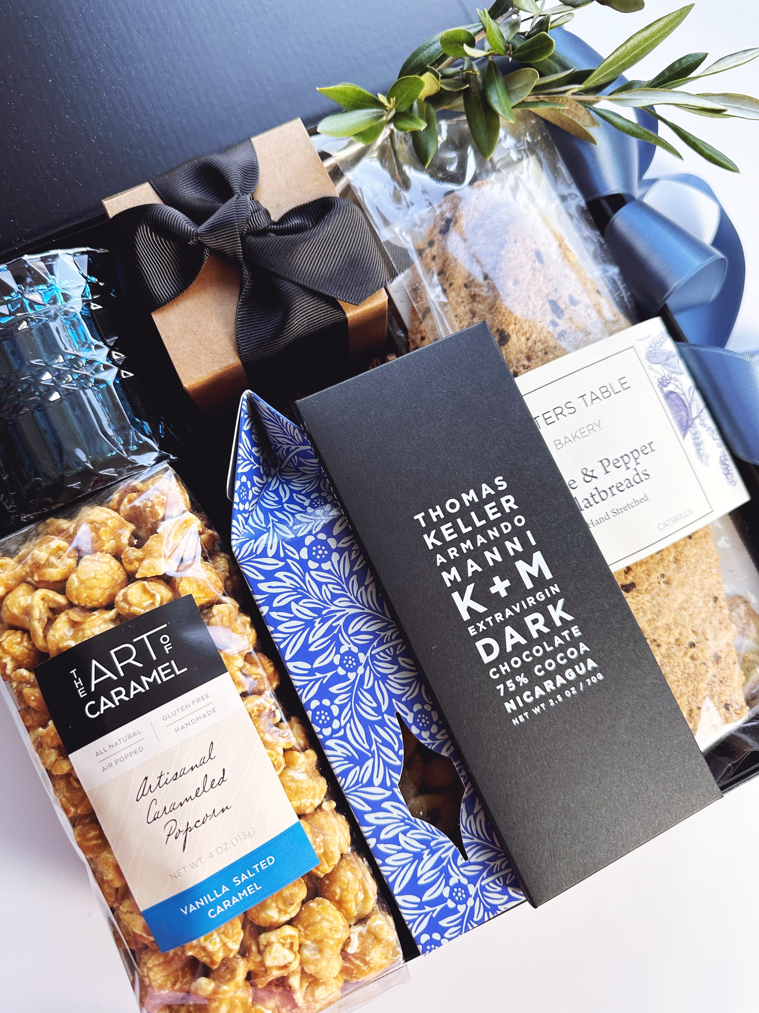 The Pacific gift box from Poppins & Post with assorted stationery and paper goods, neatly arranged inside a stylish box.