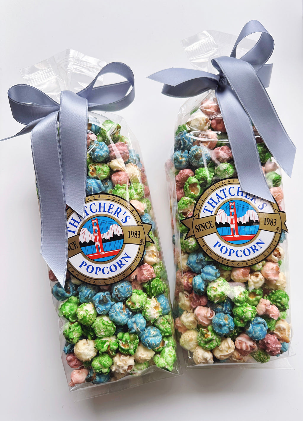 Thatcher's Gourmet Popcorn Spring Mix in an 8oz bag, featuring a colorful blend of seasoned popcorn kernels.