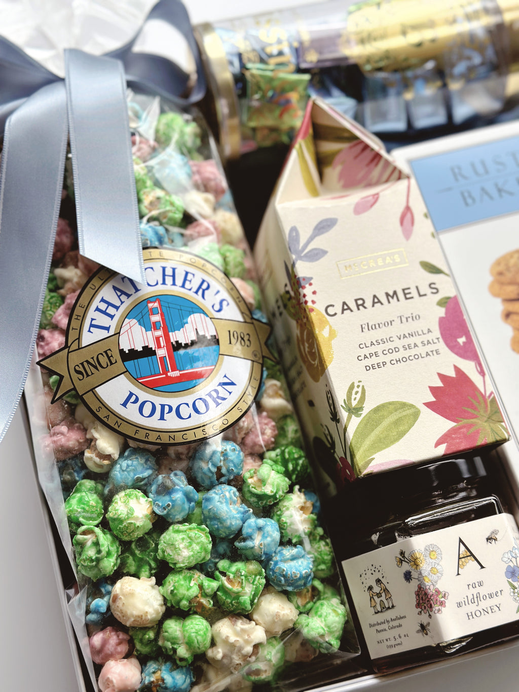 Poppins & Post The Artisan Spring Box gift box with colorful spring-themed paper and decorative accents.
