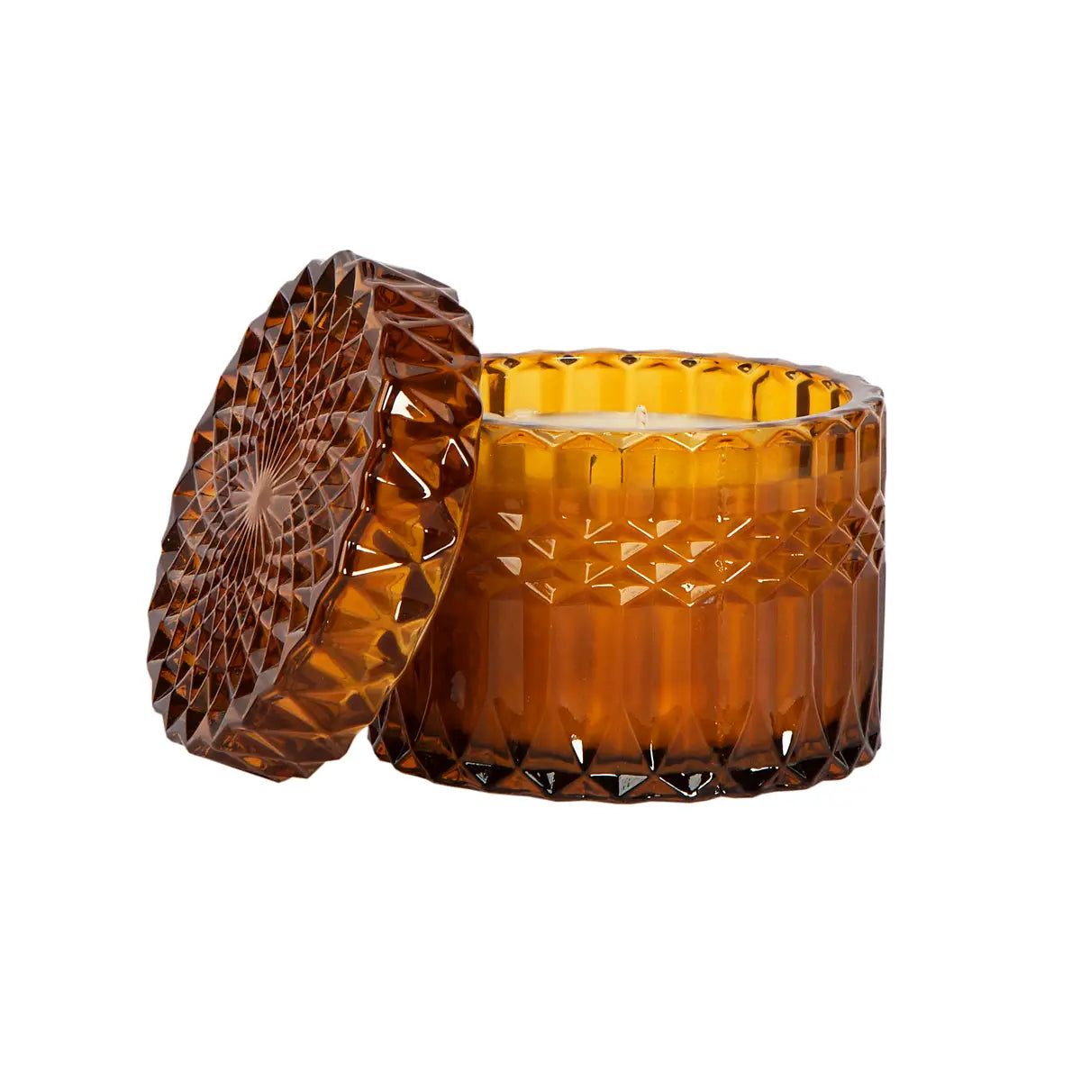 Gift-wrapped amber crystal candle from Poppins & Post, featuring a glass candle holder and decorative wrapping.