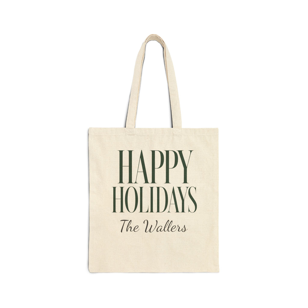 An off-white canvas tote bag with dark green text reading 'HAPPY HOLIDAYS' and 'The Wallers' underneath, shown against a plain white background.