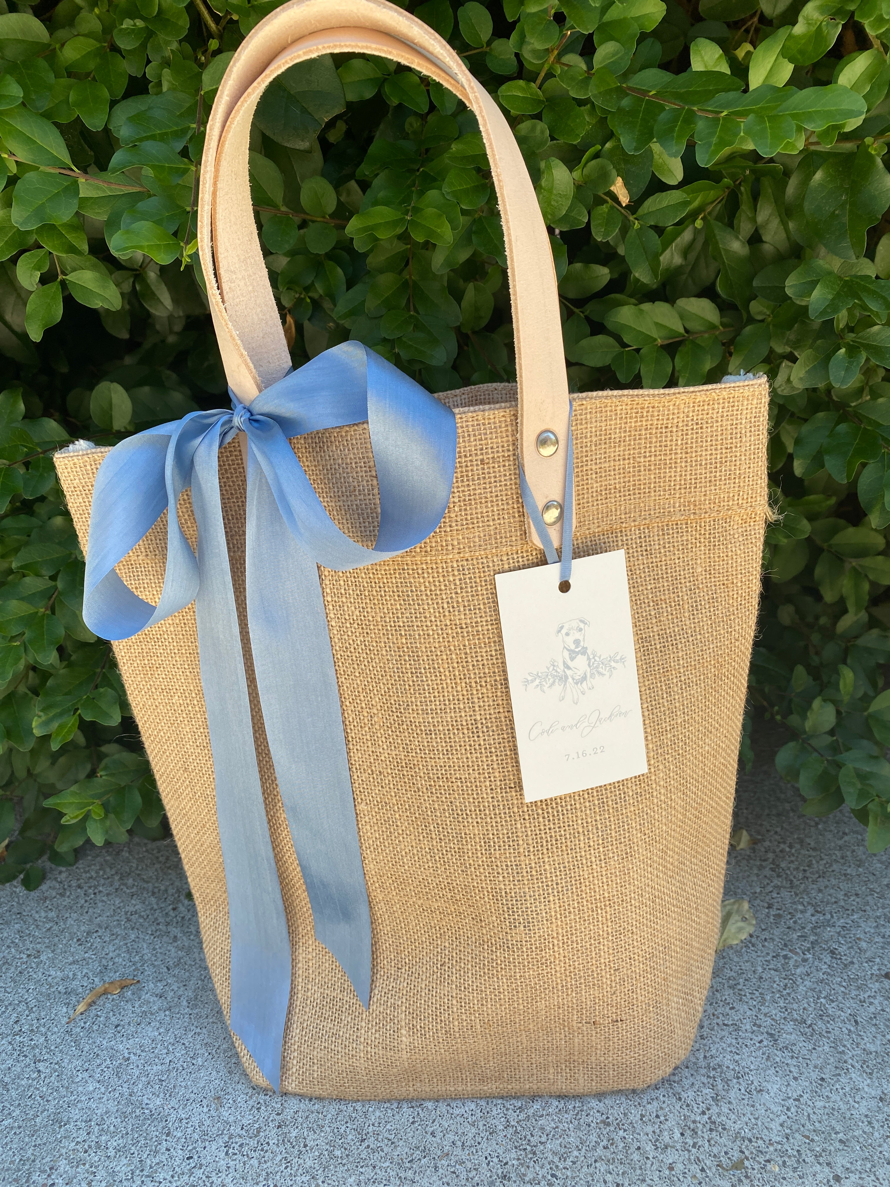 Natural jute event tote bag by Poppins & Post with sturdy handles, ideal for carrying essentials at events or outings.