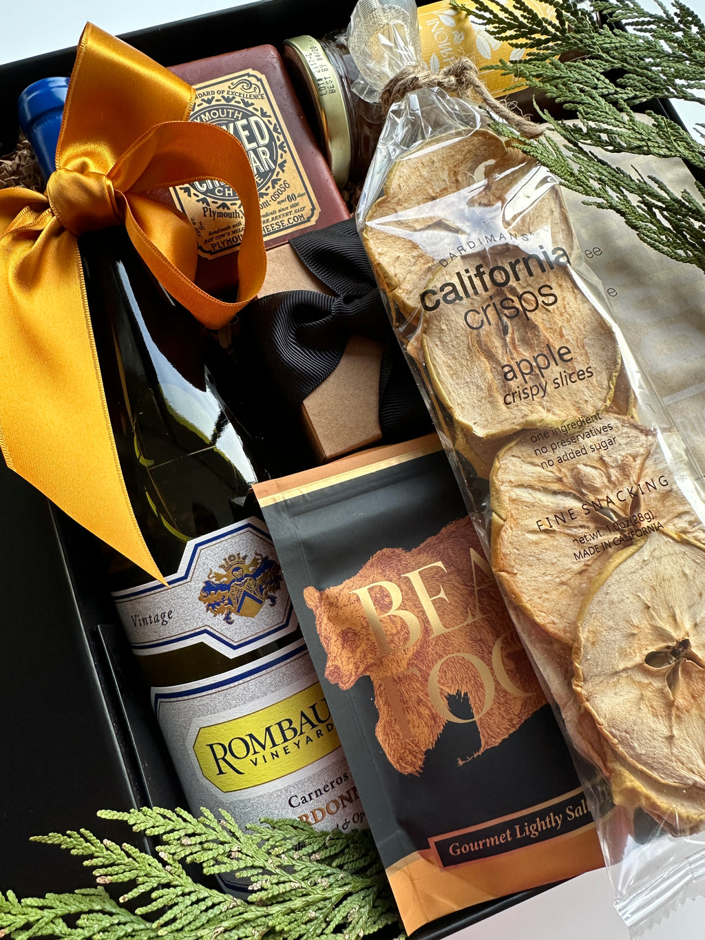 California Christmas gift box by Poppins & Post with festive wrapping, holiday-themed decorations, and assorted seasonal treats.