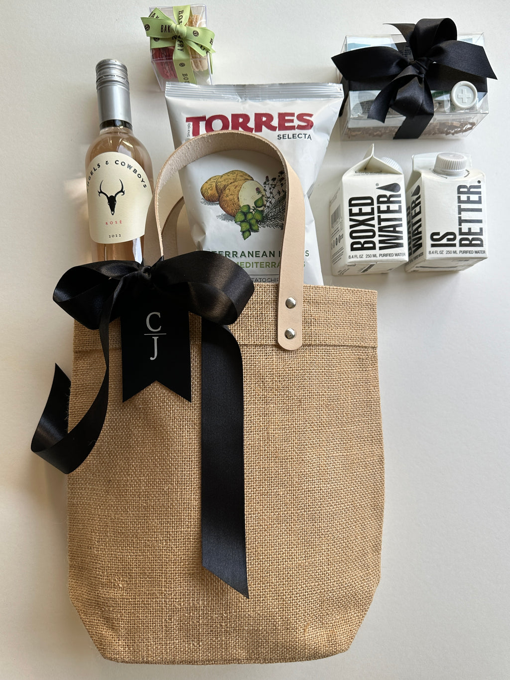 Natural jute event tote bag by Poppins & Post with sturdy handles and spacious interior for carrying essentials.
