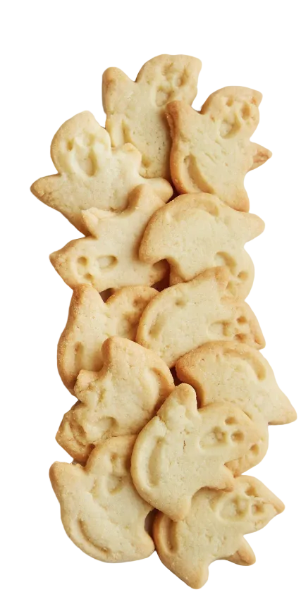 A pile of pale golden ghost-shaped cookies arranged on a white surface.