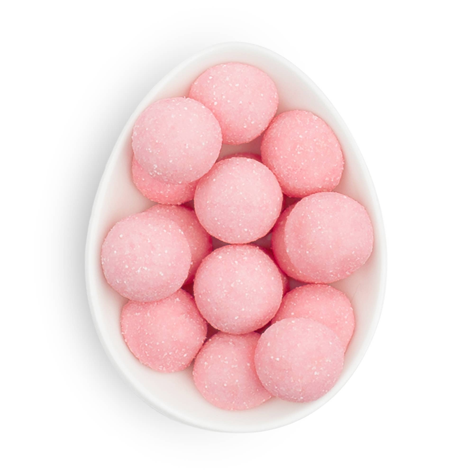 Small pink Sugarfina candy bonbons, colorful chocolate and candy treats in a clear container, perfect for sweet indulgence.