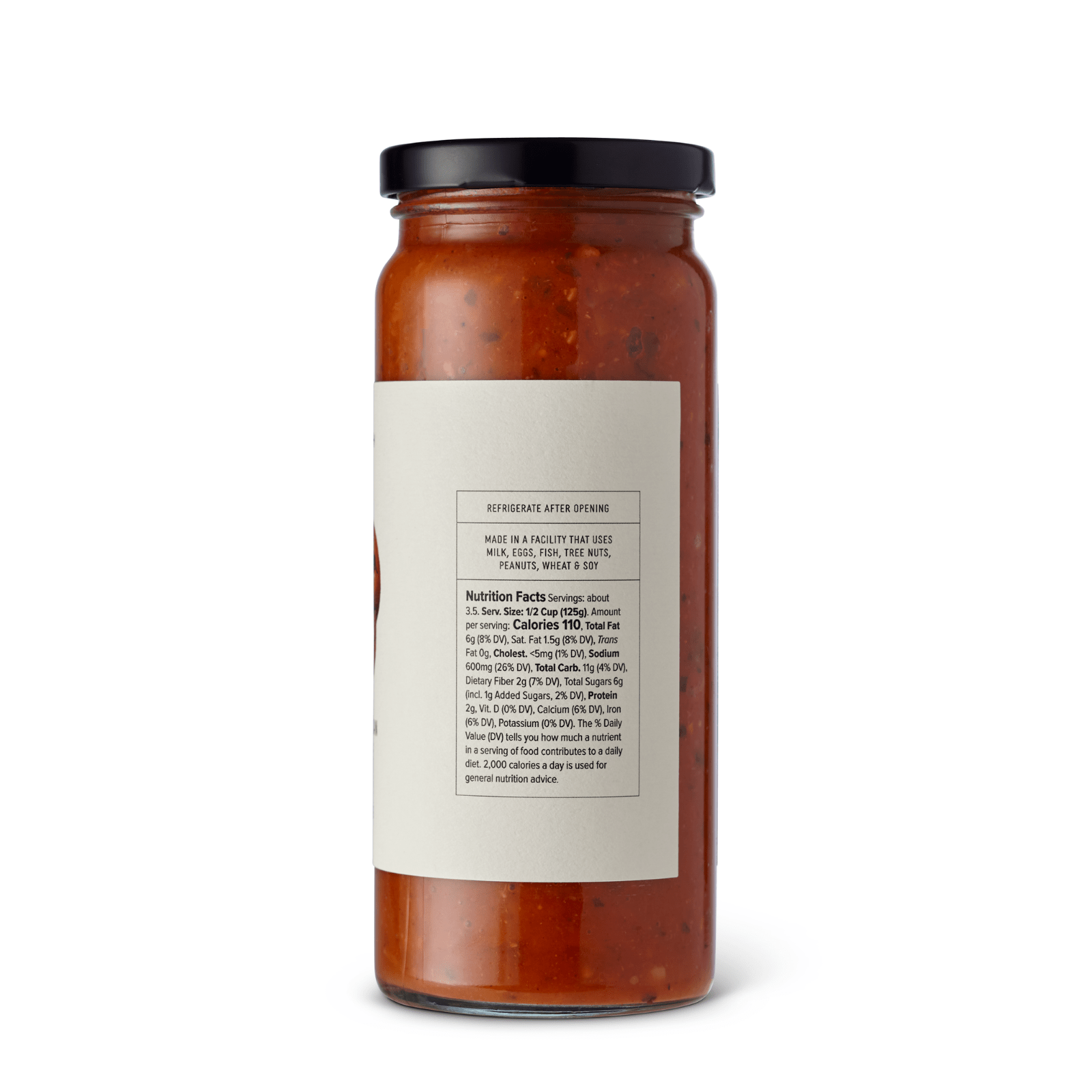 Jar of McEvoy Ranch Basil and Pine Nut Pomodoro Sauce, a 16 oz pantry staple with fresh basil and pine nuts in a glass jar.