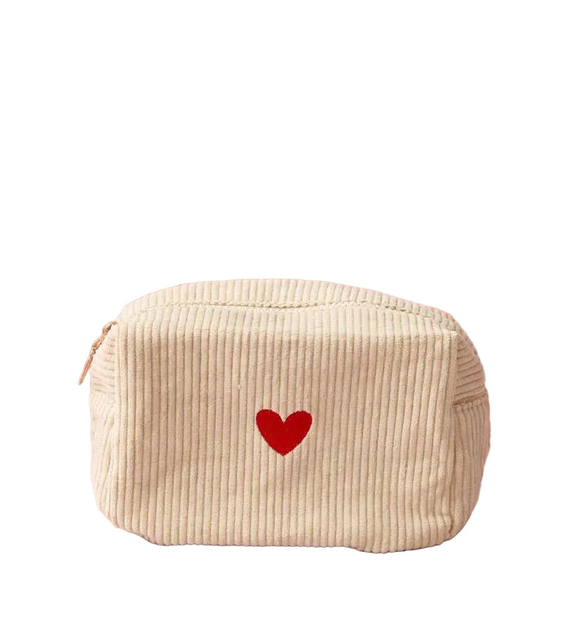 Heart-shaped makeup bag by Poppins & Post for bath and body essentials, featuring a cute heart design and zip closure.
