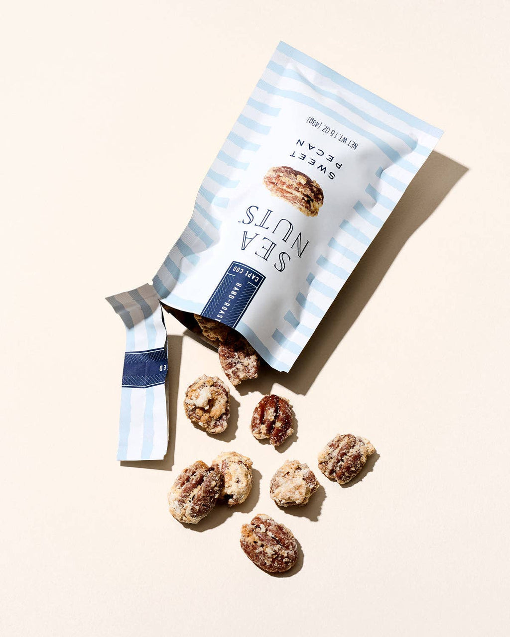Sea Nuts brand sweet pecans in a bowl, showcasing golden roasted pecans with a glossy finish and rich texture.