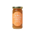 Jar of Meyer Lemon Honey Marmalade with a label on a white background from Marmalade Grove in Ojai, California.