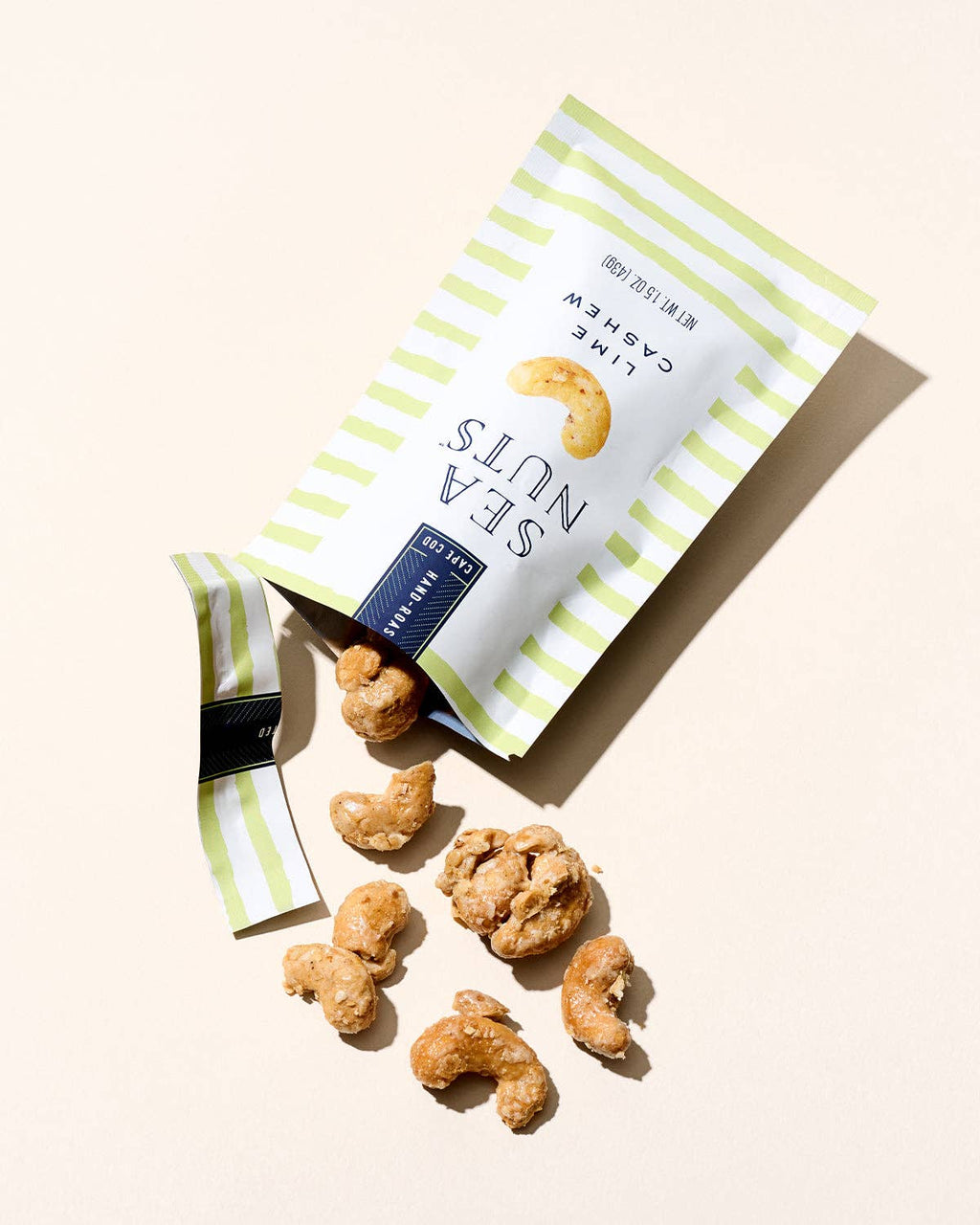 Sea Nuts Lime Cashews, crunchy roasted nuts flavored with zesty lime, shown in a close-up image.