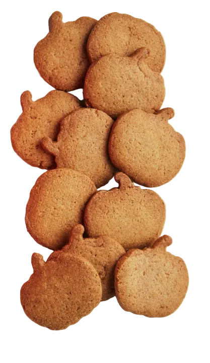 A pile of pumpkin-shaped cookies on a plain white background.