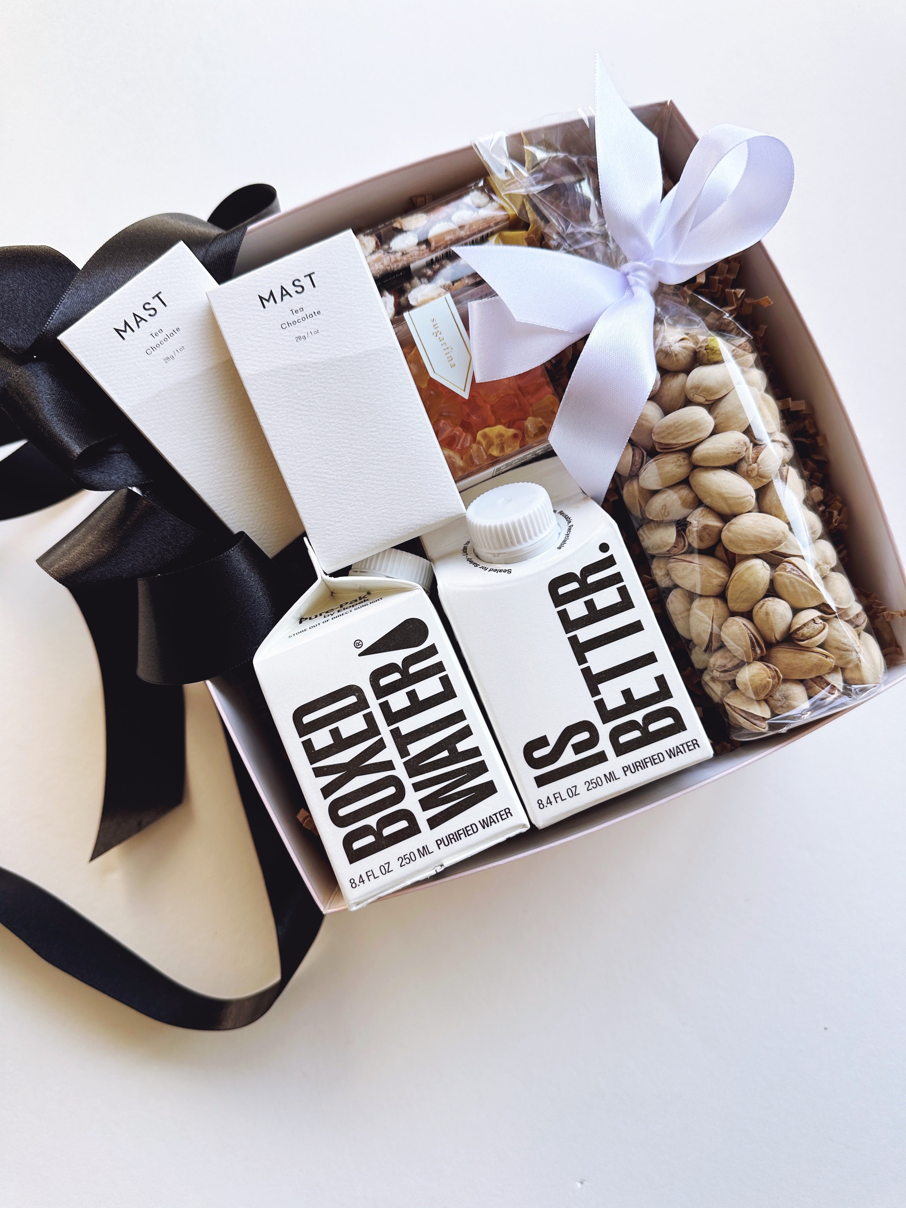 Set of 24 wedding welcome gift boxes from Poppins & Post, featuring elegant packaging for special occasions.